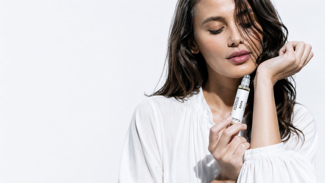 Woman applying Perfume Oil Expressions perfume oil to pulse points for better fragrance projection and longevity